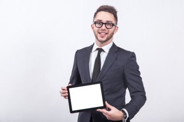 Creative young programmer in a business suit with a tie and sung