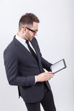 Creative young programmer in a business suit with a tie and sung