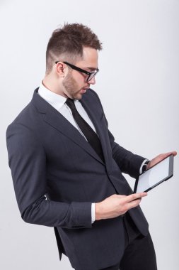 Creative young programmer in a business suit with a tie and sung