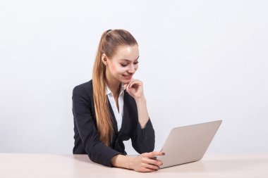 modern young business woman in a business suit on a white backgr