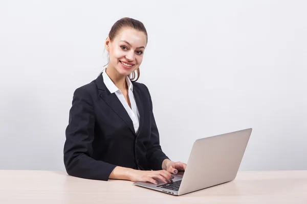 Modern young business woman in a business suit on a white backgr — Stock Photo, Image