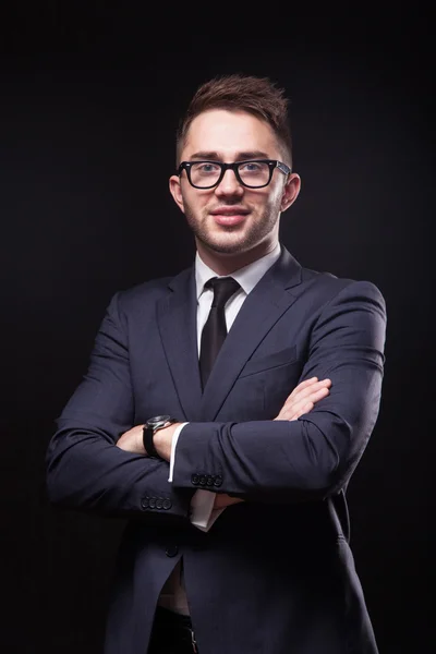 Stylish, trendy businessman in a business suit and wearing glass — Stok fotoğraf