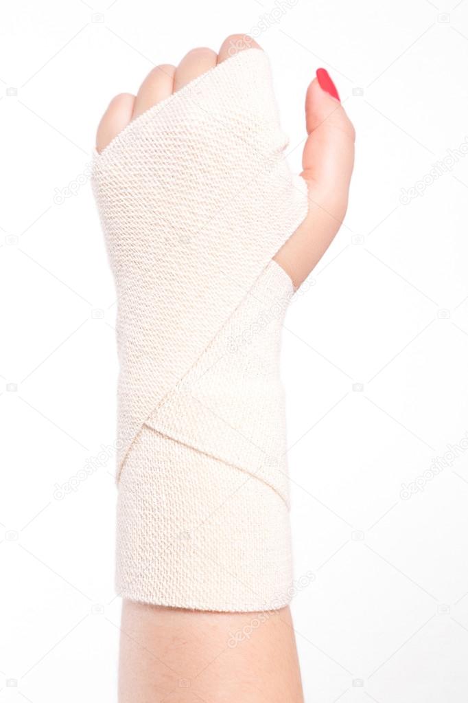 studio shot female wrists tied with an elastic bandage