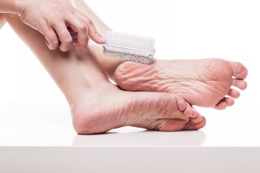 care for dry skin on the well-groomed feet and heels with the he