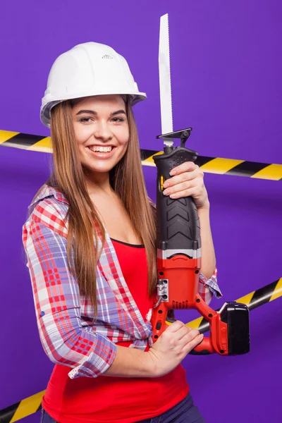 Plus-size model on a blue background with the construction of th — ストック写真
