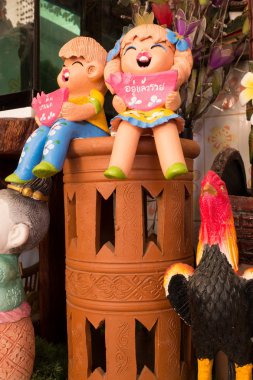 Tay gülümseme kil bebek