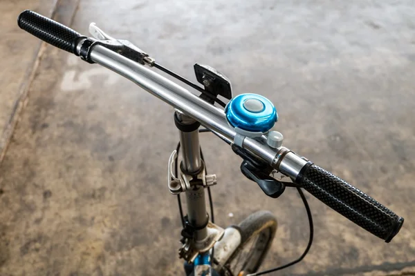 Blue bicycle bell on handlebars — Stock Photo, Image