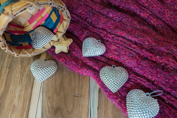 Silver heart, basket ,scarves, on wooden decorated for Valentine — Stock Photo, Image