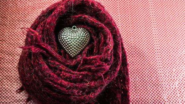 Silver heart on scarves decorated for Valentine's Day. Love conc — Stock Photo, Image