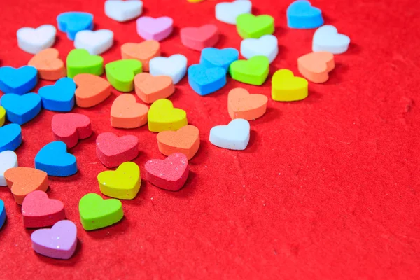 Valentines day background with colorful heart shaped on red pape — Stock Photo, Image