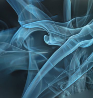 Flowing patterns of smoke from burning isolated black background.