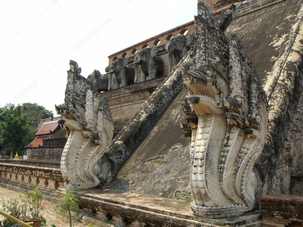 Chiang Mai, Thailand, April 25, 2016: Stupa Wat Chedi Luang in Chiang Mai with two large snakes