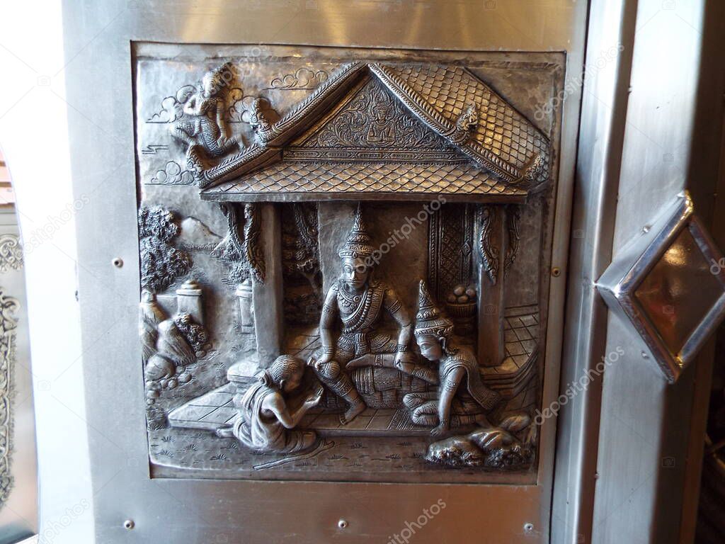Chiang Mai, Thailand, December 6, 2018: Detail of the decoration on one of the doors of the Wat Muen San temple, Chiang Mai silver temple