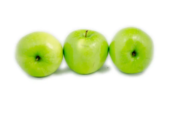 Tree green apples in different put lied on — Stock Photo, Image