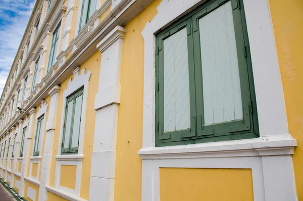 Yellow and green window building — Stock Photo, Image