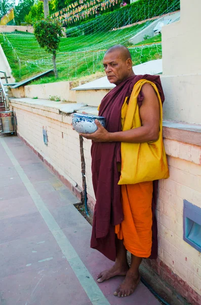 Monk waiting for money — Stock Photo, Image