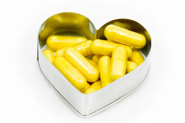 kalp içinde sarı kapsül