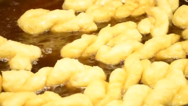 Chinese dough stick  deep fried in  hot boiled oil on pan — Stock Video