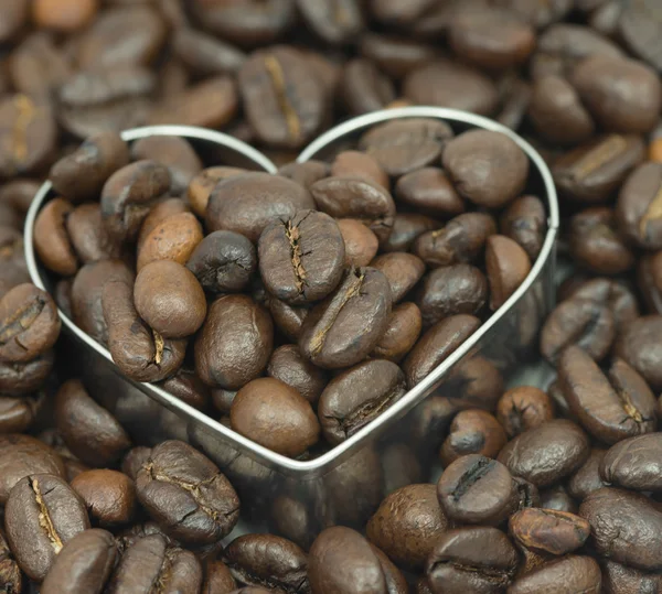 Coffee beans on in heart — Stock Photo, Image