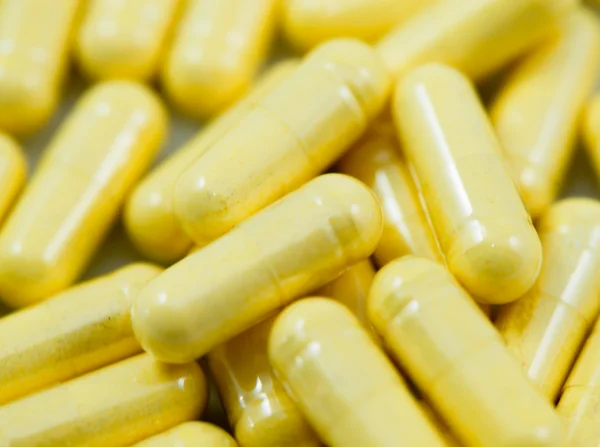 Yellow Drug Capsules Closeup — Stock Photo, Image