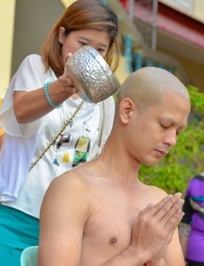 Thai male in Buddhism ordination ritual clipart