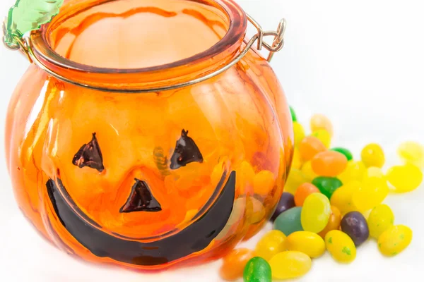 Halloween Pumpkin glass with jelly beans isolated Stock Image