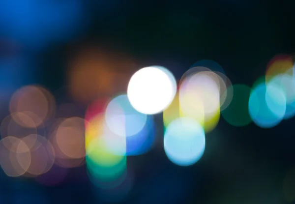 Bunte Regenbogen-Bokeh-Unschärfe in der Nacht — Stockfoto