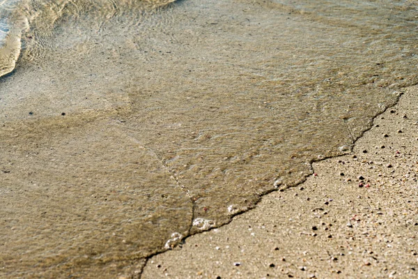 Agua de mar en playa arena primer plano — Foto de Stock