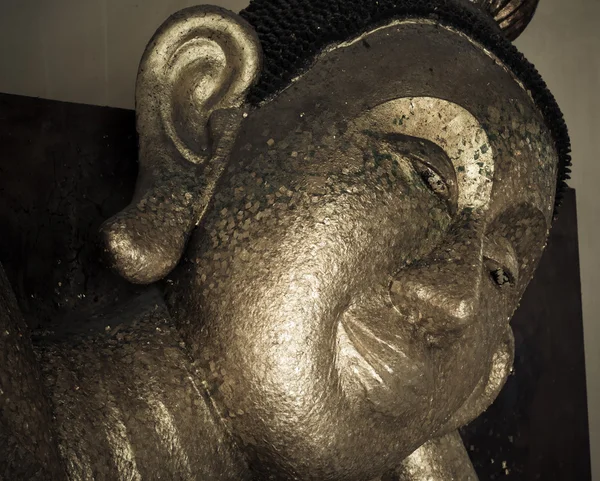 Face of Buddha sculpture closeup Stock Photo