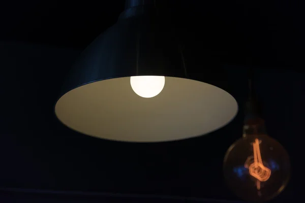 Hanged lamp in the dark room — Stock Photo, Image