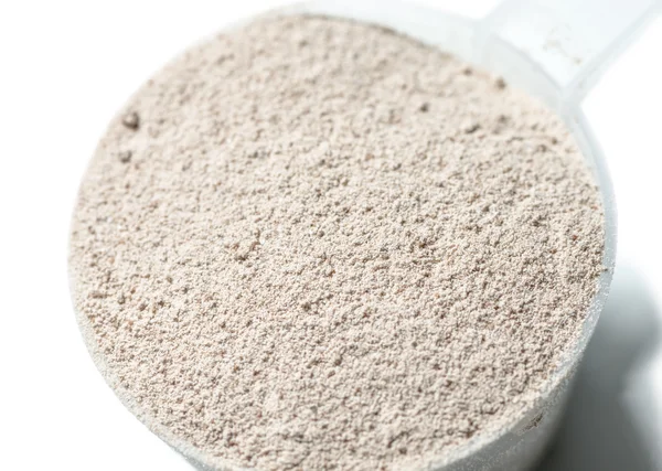 Protein powder chocolate flavour on scoop closeup isolated — Stock Photo, Image