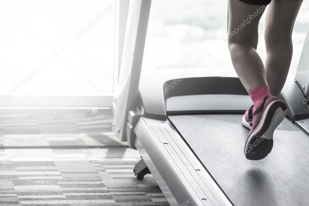 Unknown woman wear pink running shoes workout split tone