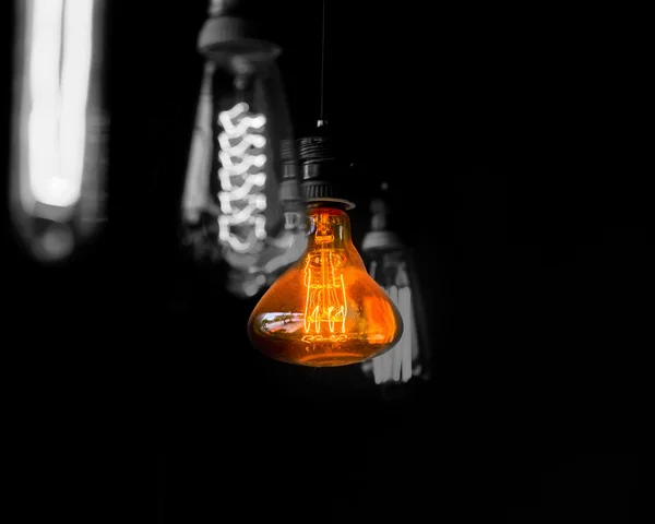 Hanged  orange decoration light bulbs focus on pear shape  one — Stock Photo, Image