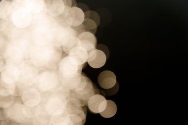 Su defocused Bokeh yansıtmak altın ve karanlık soyut backg