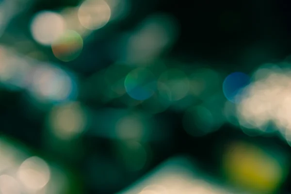 Abstract blur bokeh defocused of light in city  green yellow spl — Stock Photo, Image