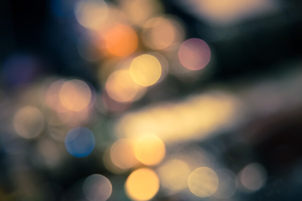 Abstract blur bokeh defocused of light in city split-tone background
