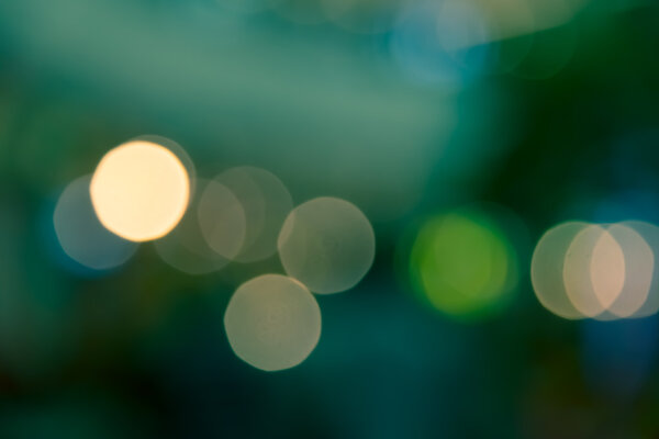 Green Bokeh blur abstract of city life background split-tone
