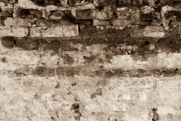 Förstörda tegelvägg med konkreta bakgrunden brun sepiaton — Stockfoto