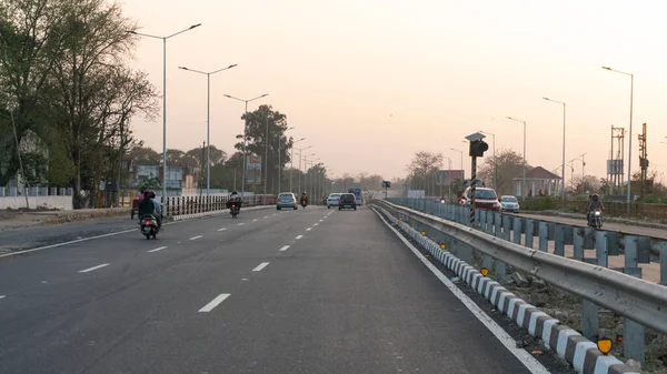 View of the highway in the evening in which traffic vehicles are visible after lock down in corona virus