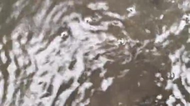 waves of river water flow with foam