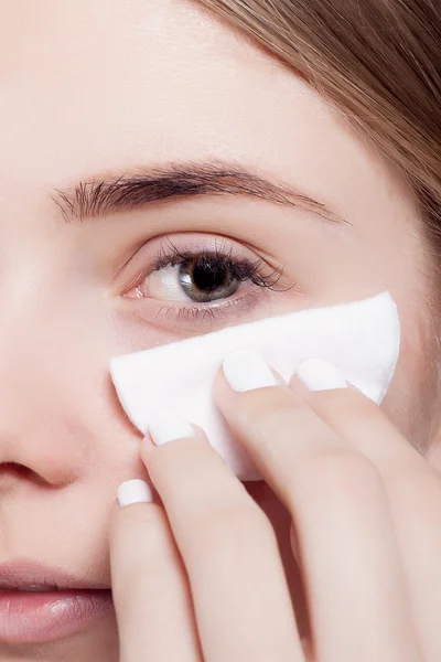 Woman using cotton pad