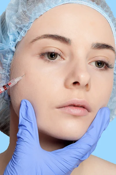 Attractive young woman gets cosmetic injection — Stock Photo, Image