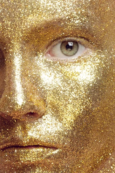 Magic Girl Portrait in Gold. Golden Makeup