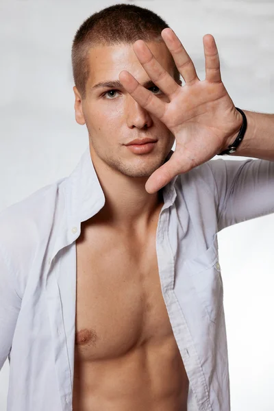 Emotive portrait of a funny handsome young man — Stock Photo, Image