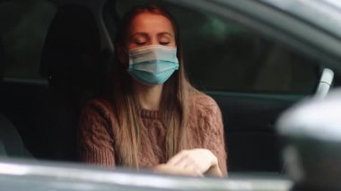 medicine, quarantine and pandemic concept - Happy Caucasian attractive young woman with long brown hair wear a protective medical face mask. Girl enjoy life during pandemic period.