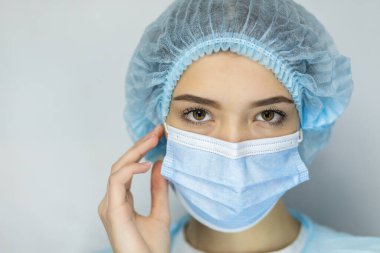 Close up headshot portrait of woman in protective medical mask from coronavirus feel anxious about pandemic, angry worried female wear face cover protecting from covid-19 corona epidemic, infectious clipart