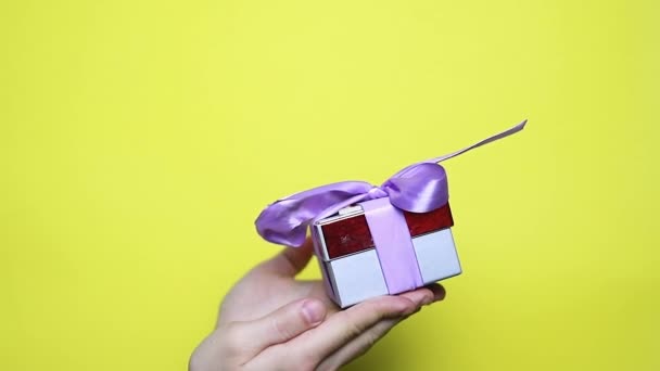 Closeup Man Hands Holding Gift Red Ribbon Christmas New Year — Stock Video