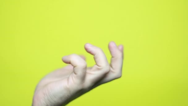 Male Outstretched Hand Yellow Background Footage — Stock Video