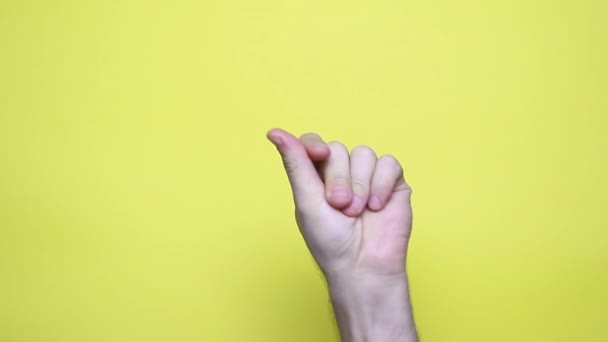 Man Hand Snaps Her Fingers Music Rhythm Gesture Isolated Yellow — Stock Video