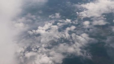 Clouds,view from airplane window, view of fields and meadows. view of the bay with turquoise water. mountain and quarry views